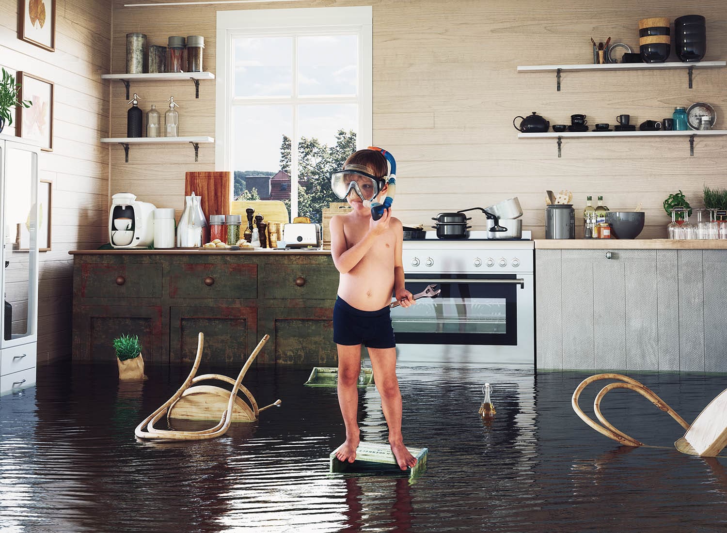 Leckageortung Hauptbild: Kind spielt mit Werkzeug in einer überfluteten Küche